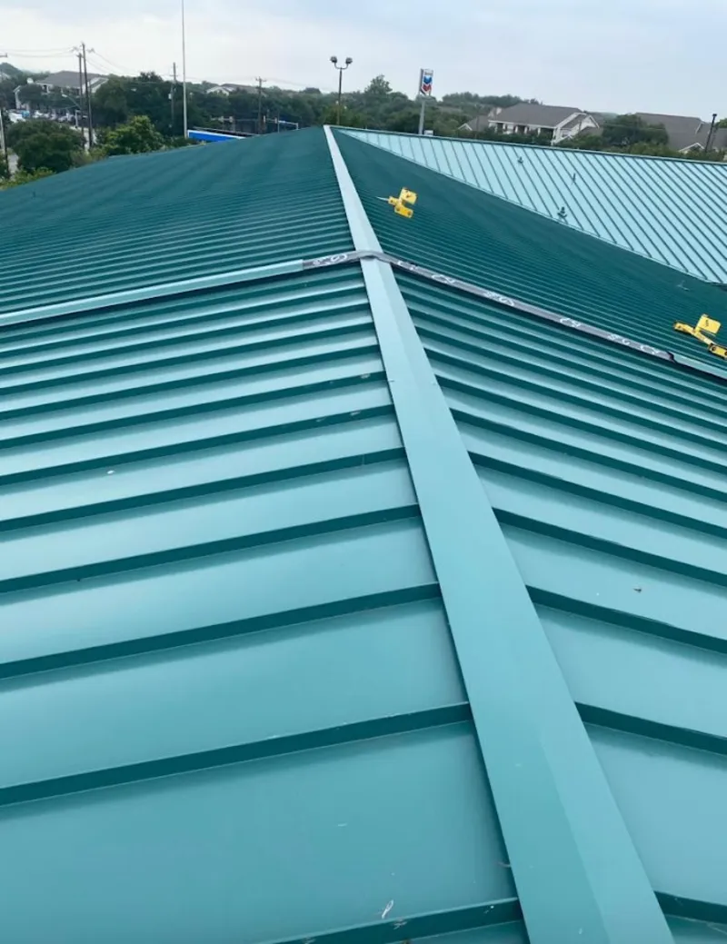 Green commercial metal roof ridge and valley for Metal Roof Repair in Madison Heights